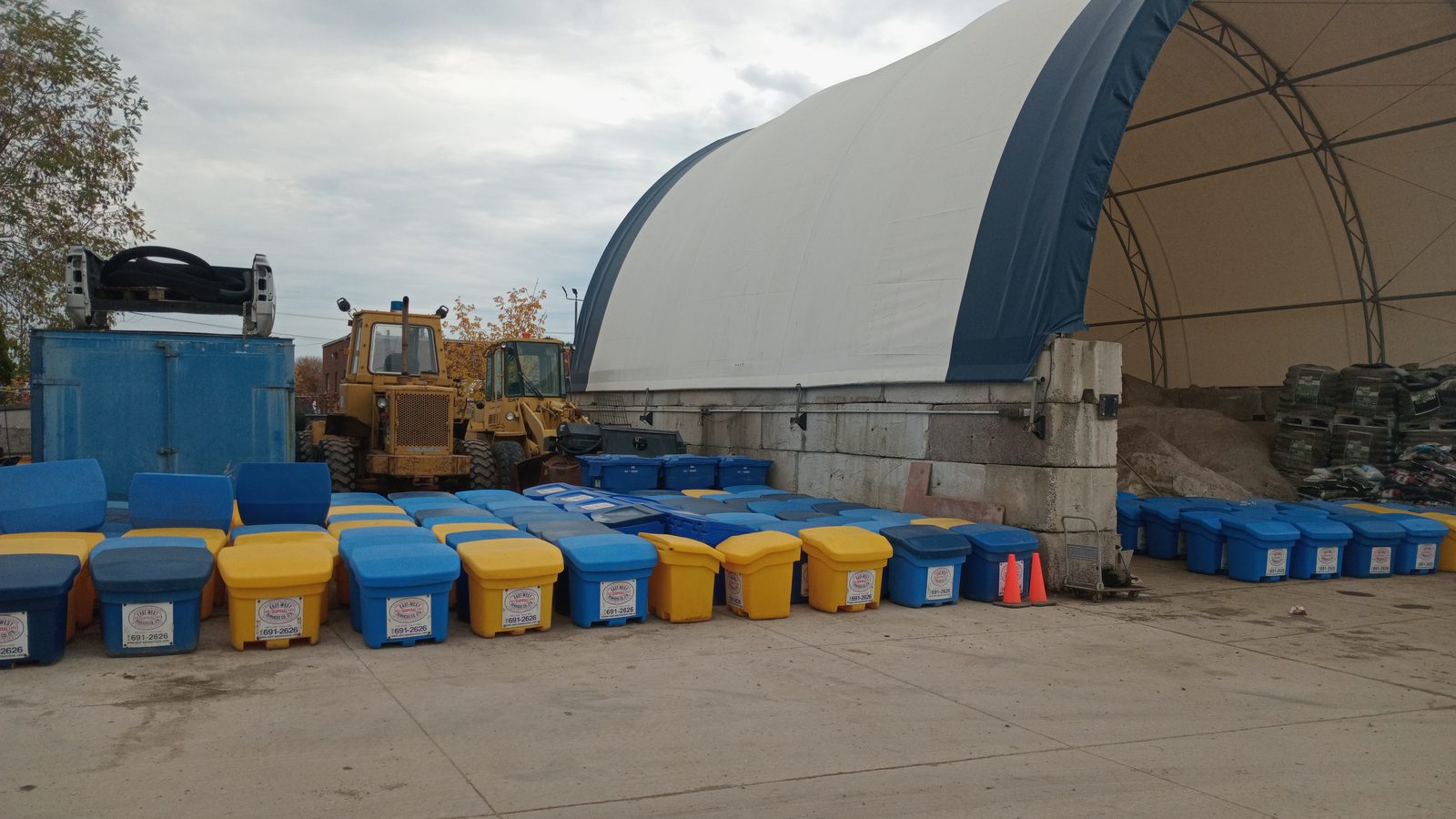 Rows of East-West salt and de-icing bins staged outside the storage dome at the Toronto yard