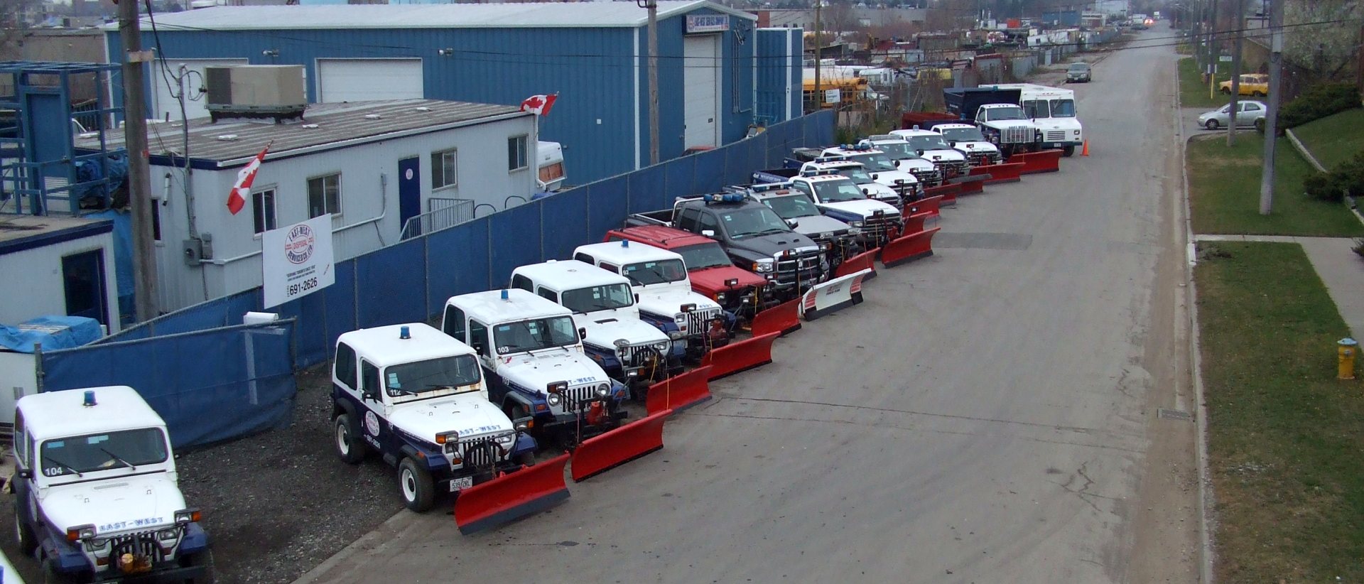 East-West commercial snow plow fleet lined up and ready for a Toronto storm